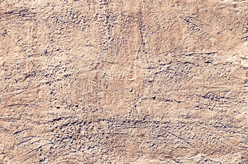 Yellow stone texture close-up. Rough yellow stone wall. Natural rock texture