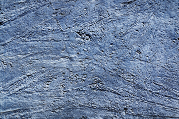 Blue stone texture close-up. Rough blue stone wall. Natural rock texture