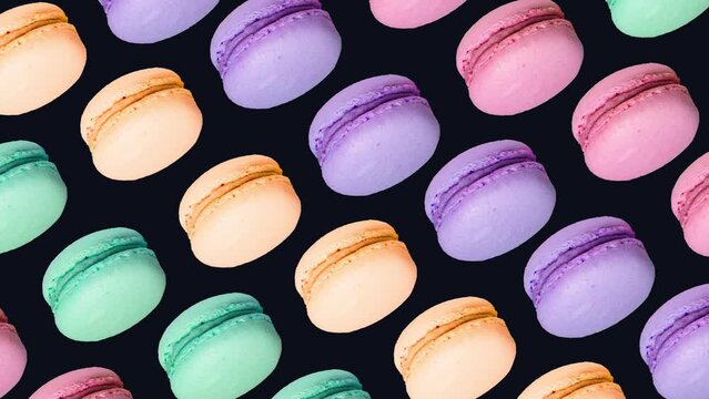 trendy food sweet animation background of macaron different colours cookies on black background