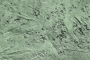 Green stone texture close-up. Rough green stone wall. Natural rock texture