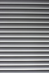 Obraz premium White horizontal blinds on the window. Decoration and convenience for home. Texture