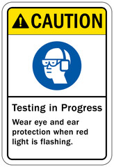 Testing in progress warning sign and labels wear eye and ear protection when red light is flashing