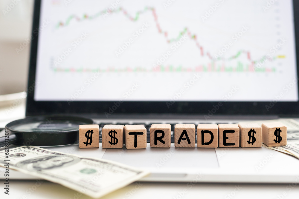Poster the word trader written in wooden block letters
