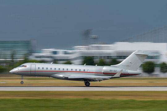VistaJet Bombardier Global 6000 with the aircraft registration 9H-VJI .during landing to the southern runway 08R of the Munich Airport MUC EDDM.