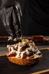 Chef preparing steak burger