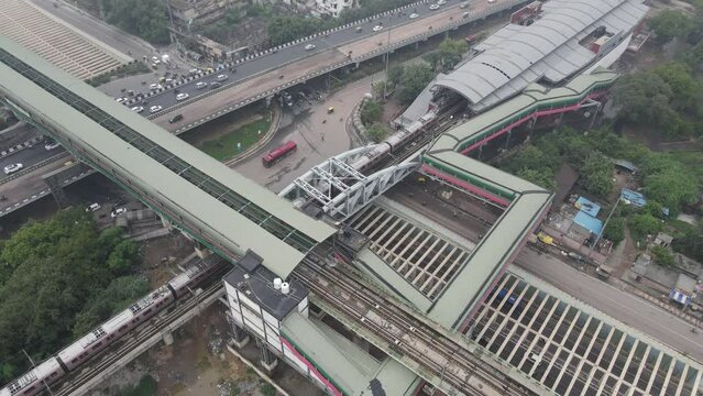 Aerial Drone shot of delhi metro train station   roads traffic vehicles cars  in New delhi india