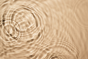 Beige water surface background. Water texture with splashes and bubbles for design. Summer...