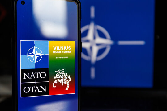 NATO Summit Vilnius Logo On Screen And Nato Flag