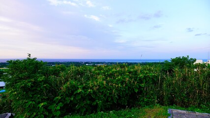 Fototapeta na wymiar 鹿児島県奄美群島与論島の舵引きの丘（ハジピキパンタ）から見える夕焼け