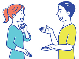 立って楽しそうに話し合う若い男性と女性