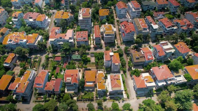 Aerial drone view of Kinaliada, Turkey. Multiple residential buildings located on the shore of Marmara sea, greenery