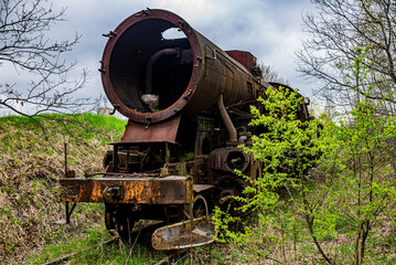 Old rusted steam locomotive abandoned at train cemetary
