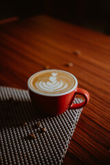 Obraz na płótnie Canvas Cup of coffee latte on wood bar