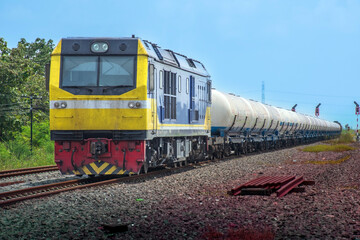 Fototapeta na wymiar Locomotive with Tanker-freight train on the railway
