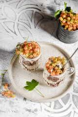 yogurt dessert with currants in a glass