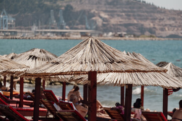 Bamboo umbrellas on the beach at the seaside