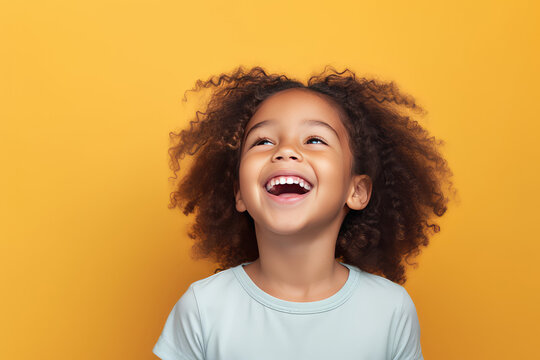 Cute junior girl laughing and smiling with curly brown hair isolated on orange flat background with copy space. Happy little girl portrait. Generative AI studio photo imitation.