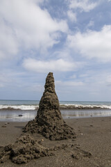 Fototapeta na wymiar Sand castle on the beach of the japanese sea