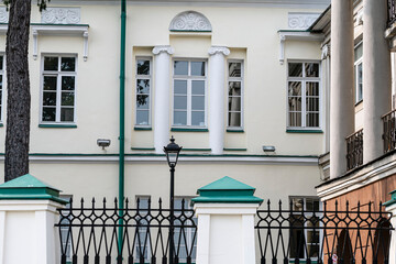 Fragment of the facade of a historic building on a summer day