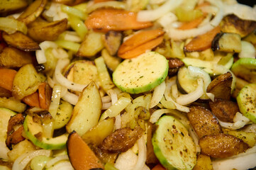 Food background. Close-up view of cooked veggies in a frying pan. Stew of fresh seasonal...