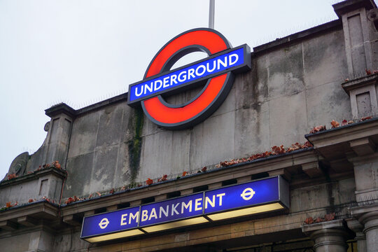 London England 9 March 2023 - Logo sign for the London Underground public transport system. Sign for subway tube station Embankment in central London 
