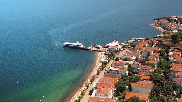 Aerial drone view of Kinaliada, Turkey. Sea port and residential buildings located on the shore of Marmara sea