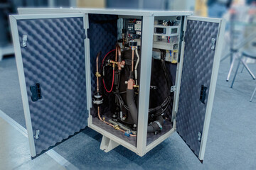Soundproof cabinet for compressor refrigeration unit.