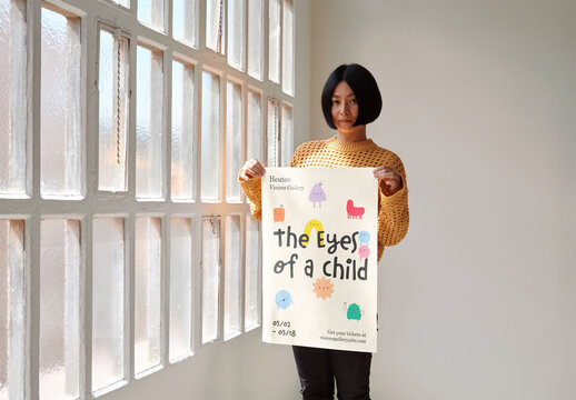 Mockup of Japanese woman holding customizable A2 poster, looking at camera
