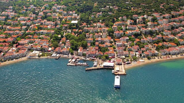 Aerial drone view of Kinaliada, Turkey. Sea port and residential buildings located on the shore of Marmara sea