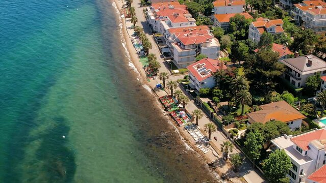 Aerial drone view of Kinaliada, Turkey. Sea port and residential buildings located on the shore of Marmara sea