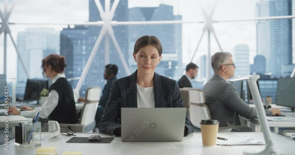 Poster professional female project manager typing on laptop computer in skyscraper office in downtown. succ