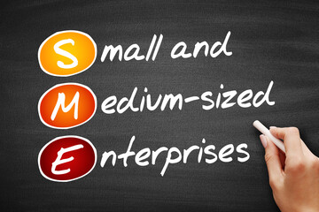 SME - Small And Medium-sized Enterprises, acronym business concept on blackboard