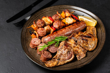 Italian assortment of grilled meats on a brown plate - grigliata di carne mista. Lamb, beef,...