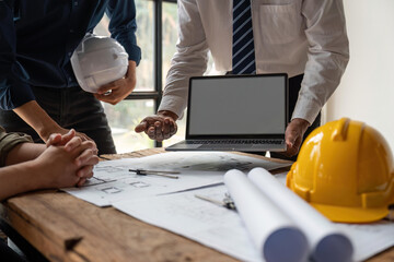 engineer team working in office with blueprints, inspection in workplace for architectural plan, construction project ,Business construction