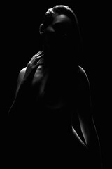 Nude Woman silhouette in the dark. Beautiful Naked Body Girl