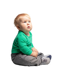Toddler, a boy sitting and looking at copy space. Isolated on transparent white background