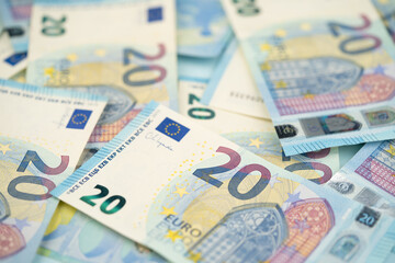 many 20 euro bills close-up mixed randomly