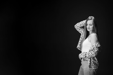 Beauty girl looking down. Young smiling woman isolated on wall with copy space. Portrait of female...