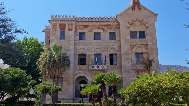 Exterior front view of beautiful Florio Palace or or Villa or Palazzo Florio at Favignana in Sicily, Italy. Tilt-down