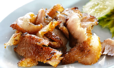 Slice grilled pork in plate.