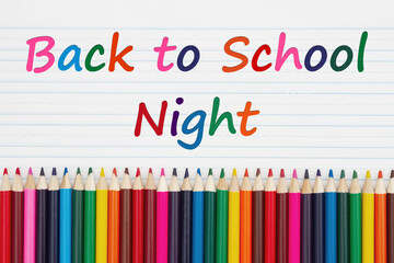 Back to School Night message with color pencils crayons on vintage ruled line notebook paper
