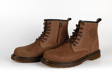 BANGKOK, THAILAND - July 10, 2023 : Close-up HEAVY Safety Shoes isolated on White Background. Genuine leather shoes with steel toe caps for protection. Illustrative Editorial.