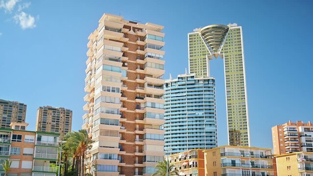 Sunny view of the city buildings in Benidorm, Spain. Clear sky