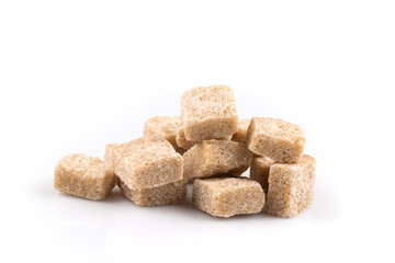 Heap brown sugar cubes isolated