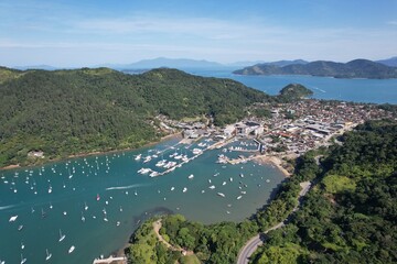 Drone view of Saco da Ribeira. Ubatuba, Brazil. Port of sailboats and boats.