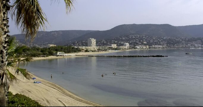 View of Gouron beach and Lavandou in the morning, beach just cleaned by tractor