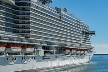 Big modern MSC Cruises cruiseship or cruise ship liner Seaside Seaview in port with downtown Genova...