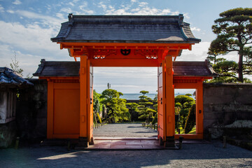Main Gate of Sengan-en, Traditional  Japanese Garden in Kagoshima, front view, orange, passage, transition