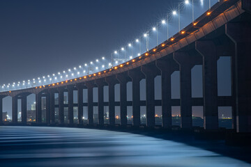 bridge and street lights over the sea
