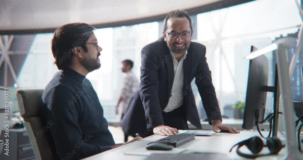 Aufkleber Two Diverse Multiethnic Indian Colleagues Having a Conversation While Busy Working on a Business Project. Software Engineer Talking with a Project Manager. Teamwork in a Modern Corporate Office